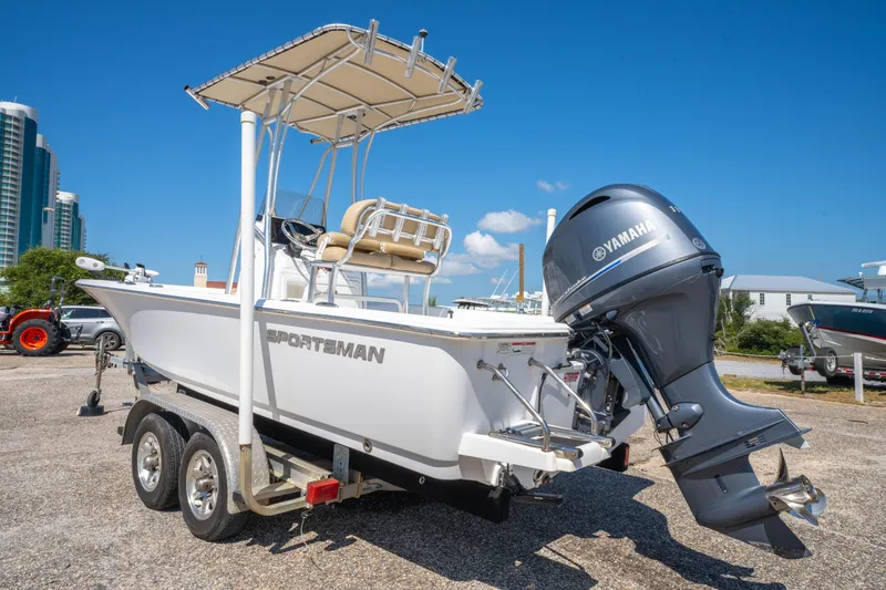Slide: The Image of 2016 Sportsman Masters 207 Bay Boat with Yamaha engine on trailer, parked outdoors. - 6