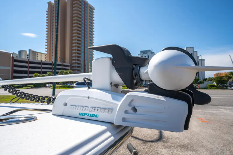 Slide: The Image of Minn Kota Riptide motor on 2016 Sportsman Masters 207 Bay Boat, urban backdrop. - 9