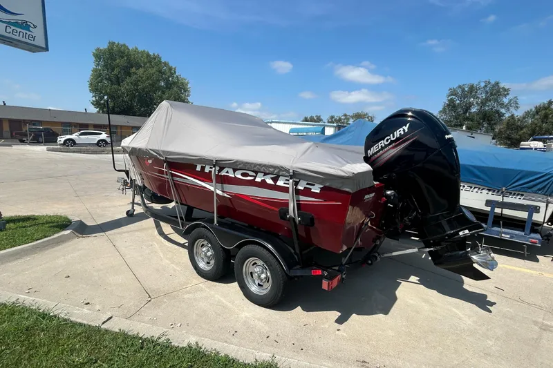 Slide: The Image of 2016 Tracker Targa V-18 Combo boat with cover and Mercury outboard motor. - 11