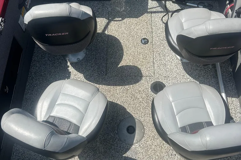 Slide: The Image of 2016 Tracker Targa V-18 Combo boat interior with four gray seats. - 14