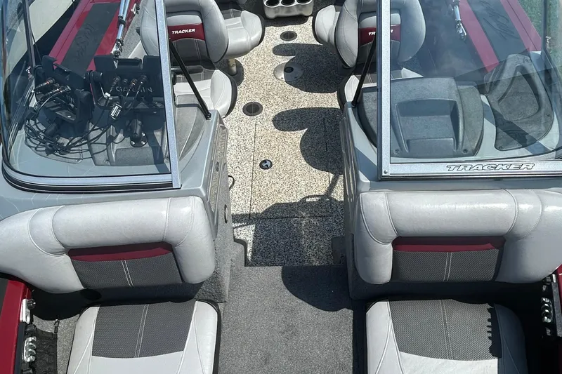 Slide: The Image of 2016 Tracker Targa V-18 Combo boat interior with seating and dashboard view. - 17