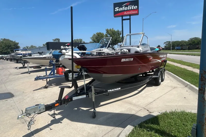 Slide: The Image of 2016 Tracker Targa V-18 Combo boat on trailer, parked near Safelite AutoGlass sign. - 5