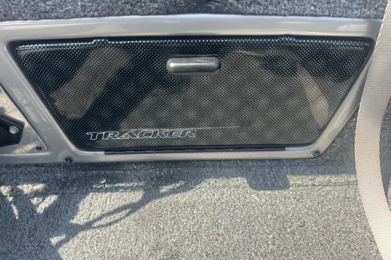 Slide: The Image of 2016 Tracker Targa V-18 Combo interior detail with textured panel and logo. - 7