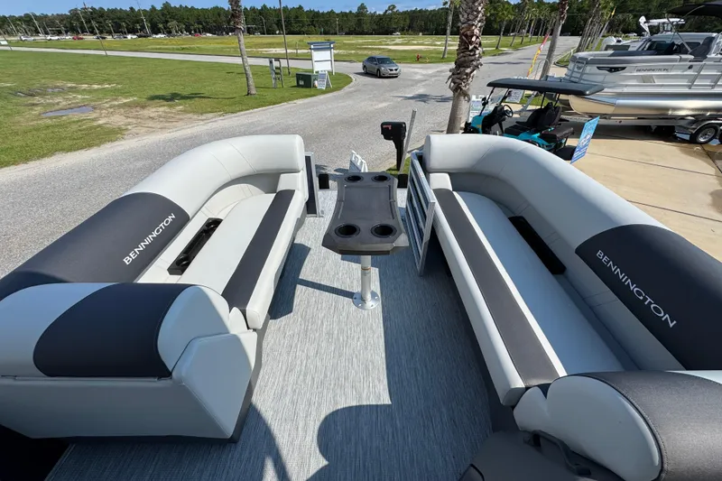 Slide: The Image of 2026 Bennington 22 SSB pontoon boat interior with gray seating and central table. - 17