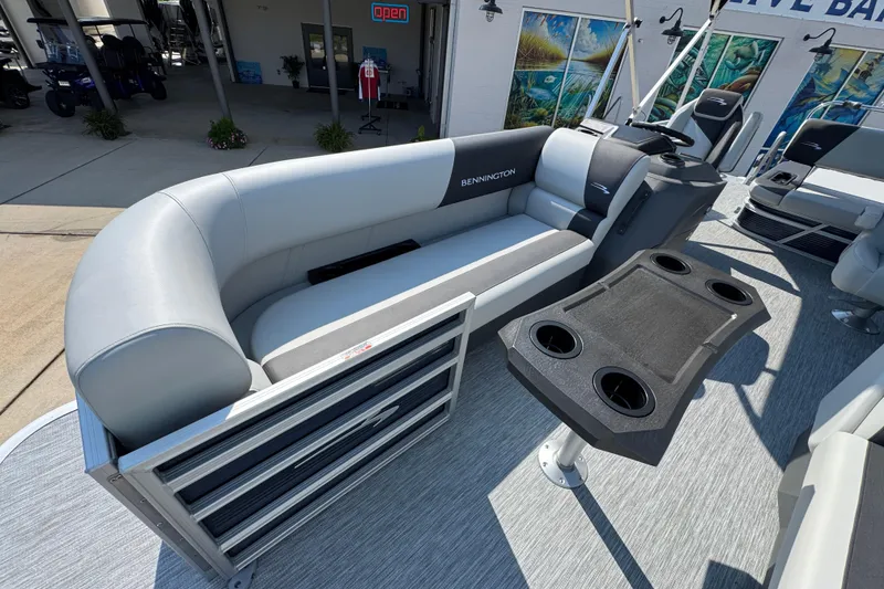 Slide: The Image of 2026 Bennington 22 SSB pontoon boat interior with seating and cup holders. - 20