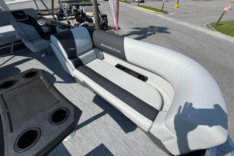 Slide: The Image of 2026 Bennington 22 SSB boat interior with plush seating and cup holders. - 21