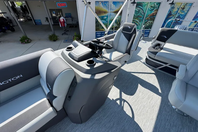 Slide: The Image of 2026 Bennington 22 SSB boat interior with modern seating and steering console. - 23