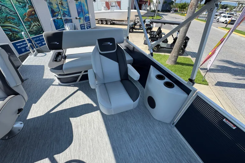 Slide: The Image of 2026 Bennington 22 SSB pontoon boat interior with seating and cup holders. - 24