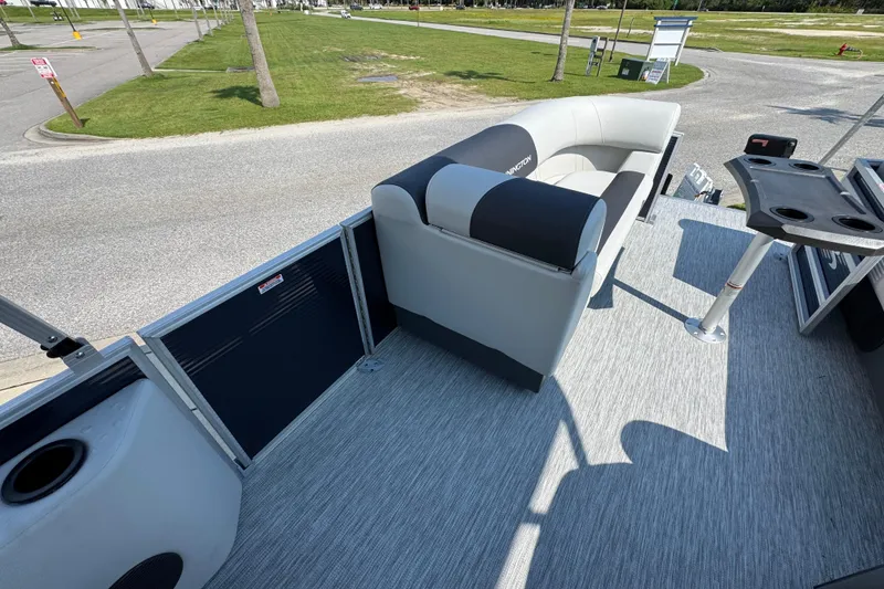 Slide: The Image of 2026 Bennington 22 SSB pontoon boat interior with seating and cup holders. - 25
