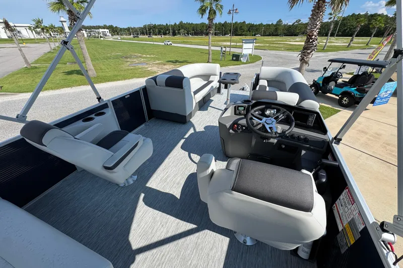 Slide: The Image of 2026 Bennington 22 SSB pontoon boat interior with seating and steering console. - 28
