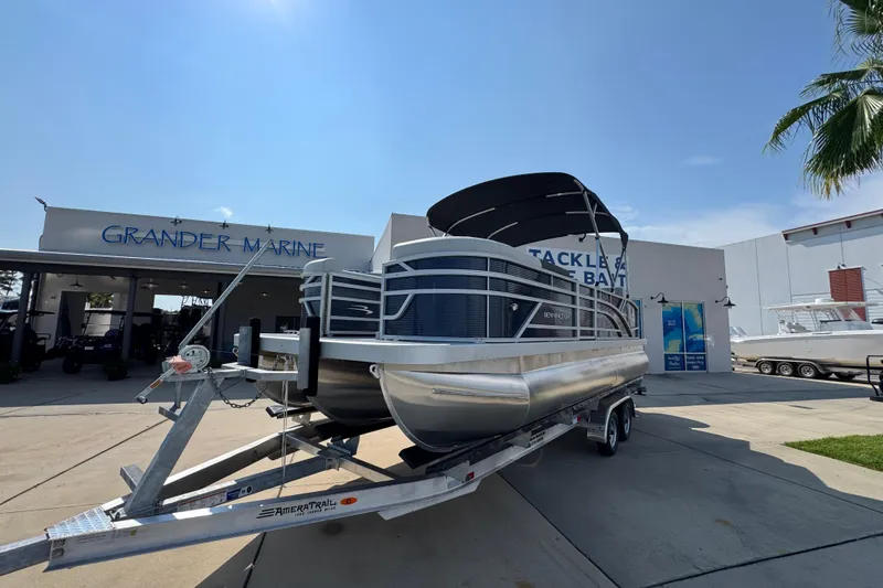 Slide: The Image of 2026 Bennington 22 SSB pontoon boat on trailer at Grander Marine dealership. - 4