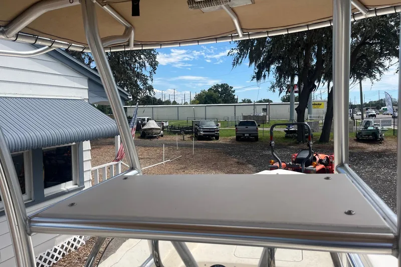 Slide: The Image of View from 2009 Scout 221 Winyah Bay boat, showcasing outdoor dealership scene. - 6