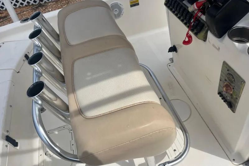 Slide: The Image of 2009 Scout 221 Winyah Bay boat interior with rod holders and control panel. - 8