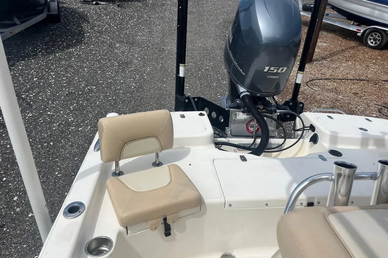 Slide: The Image of 2009 Scout 221 Winyah Bay boat with Yamaha 150 engine and beige seating. - 9