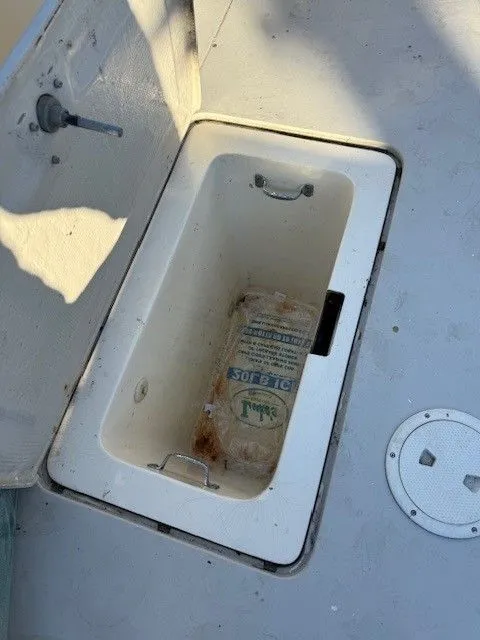 Slide: The Image of Open storage compartment on 1988 Blackfin 32 Flybridge boat deck. - 31
