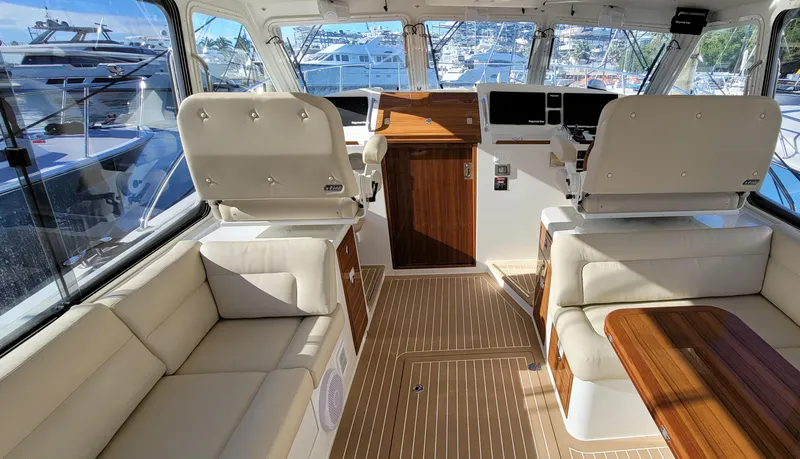 Slide: The Image of Interior of 2021 MJM 53z yacht with luxurious seating and modern helm. - 18