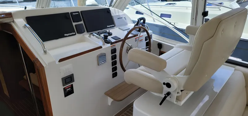 Slide: The Image of Helm of 2021 MJM 53z yacht with modern controls and comfortable seating. - 22