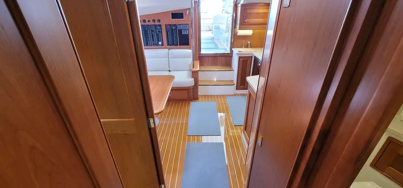 Slide: The Image of Interior of 2021 MJM 53z yacht with wooden flooring and seating area. - 39
