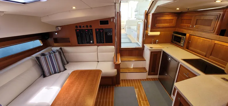 Slide: The Image of Luxurious interior of 2021 MJM 53z yacht with modern kitchen and cozy seating area. - 40