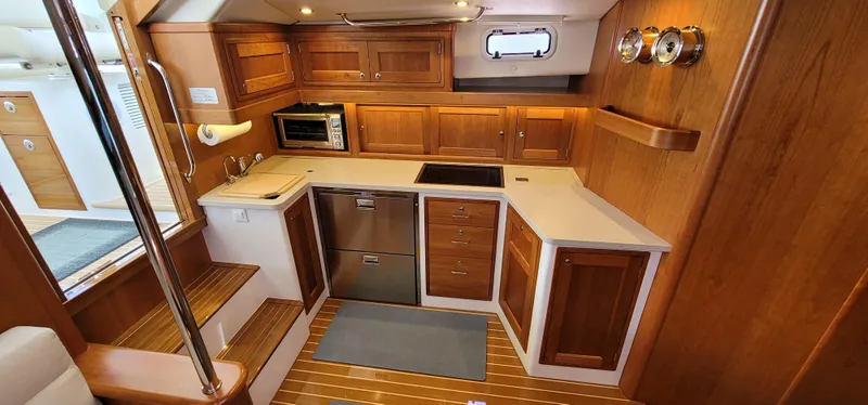 Slide: The Image of Luxurious wooden kitchen interior of 2021 MJM 53z yacht with modern appliances. - 41
