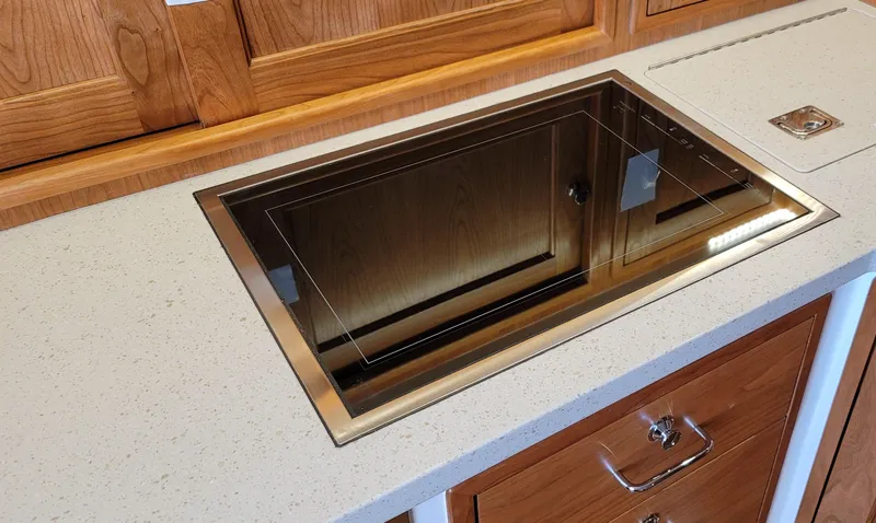 Slide: The Image of Modern kitchen countertop with built-in induction cooktop on MJM 53z yacht, 2021 model. - 44