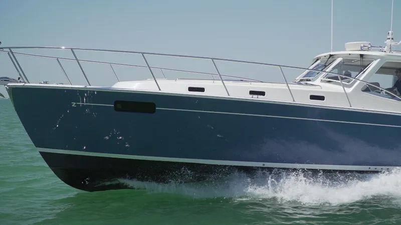 Slide: The Image of 2021 MJM 53z yacht cruising on open water. - 7