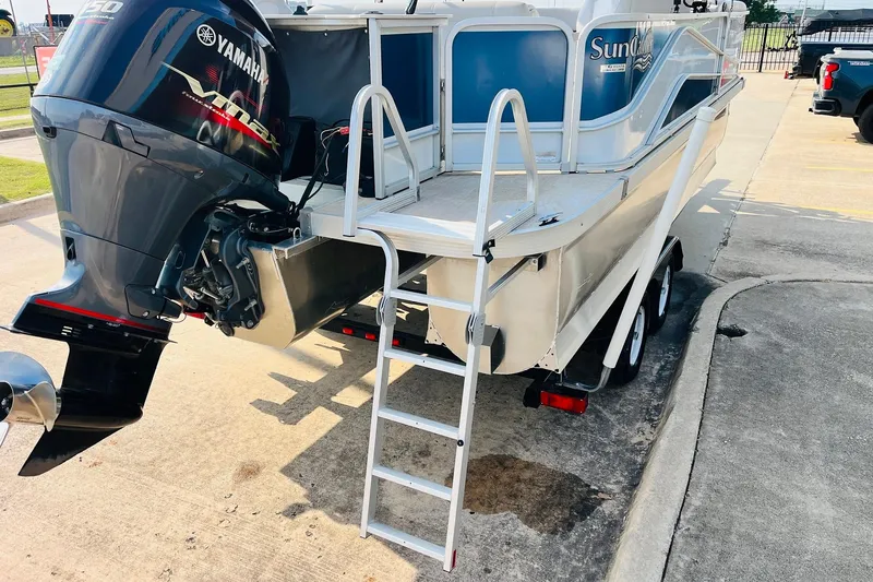 Slide: The Image of 2019 SunCatcher V322 RF boat interior with plush seating and modern dashboard. - 10