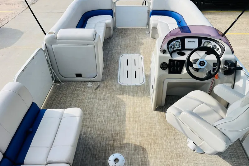 Slide: The Image of 2019 SunCatcher V322 RF boat interior with seating and storage compartments. - 12