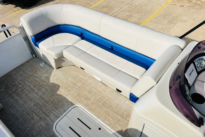 Slide: The Image of 2019 SunCatcher V322 RF boat seat with storage compartment, featuring blue and white upholstery. - 17