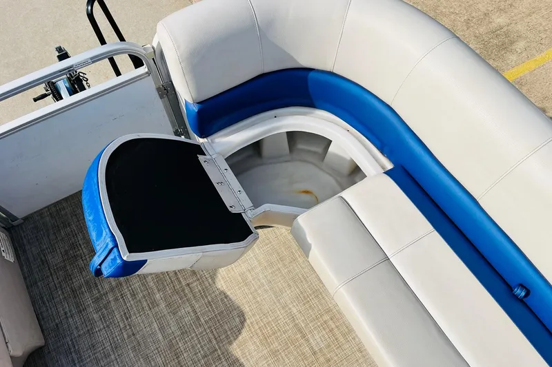 Slide: The Image of 2019 SunCatcher V322 RF boat interior with open storage compartment and seating. - 19