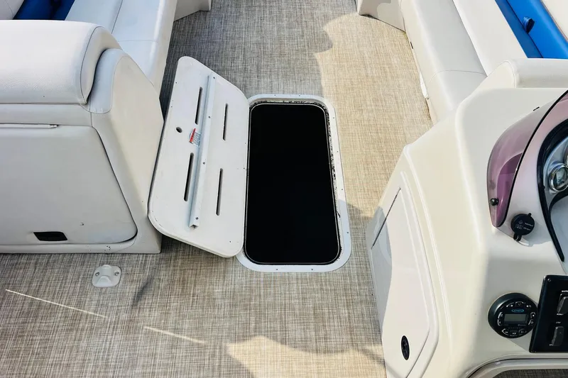 Slide: The Image of Luxurious seating on 2019 SunCatcher V322 RF boat, featuring white and blue upholstery. - 21