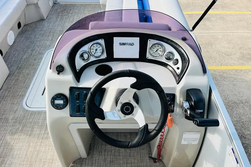 Slide: The Image of 2019 SunCatcher V322 RF boat interior with swivel chair and control panel. - 28
