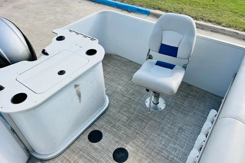 Slide: The Image of 2019 SunCatcher V322 RF boat deck with motor and ladder, featuring a clean, spacious layout. - 30