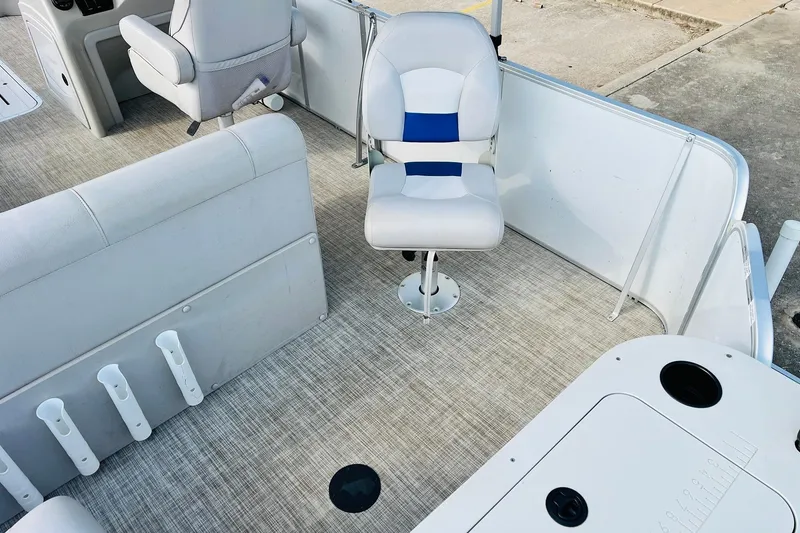 Slide: The Image of 2019 SunCatcher V322 RF boat with motor, ladder, and storage compartment on deck. - 31