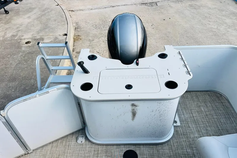 Slide: The Image of 2019 SunCatcher V322 RF boat deck with storage compartment and cup holders. - 32