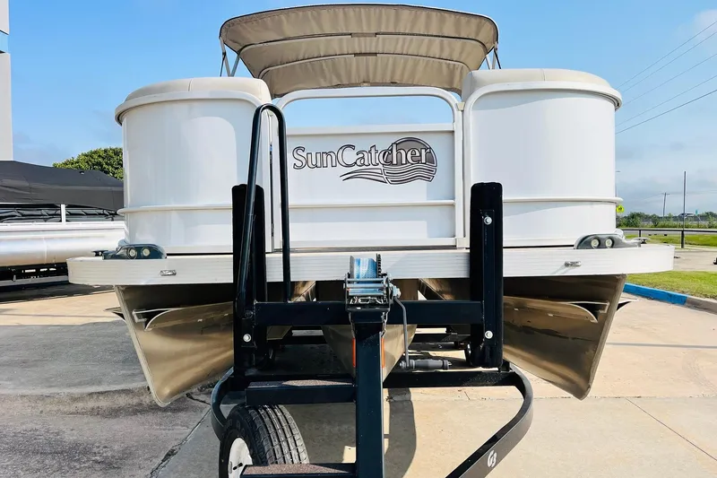 Slide: The Image of 2019 SunCatcher V322 RF pontoon boat on trailer, featuring Yamaha outboard motor. - 4