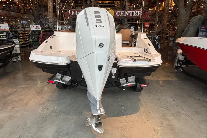 Slide: The Image of 2025 Tahoe 2150 boat with powerful V6 engine displayed indoors. - 2