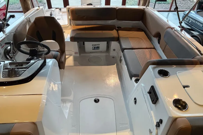 Slide: The Image of Interior of 2025 Tahoe 2150 boat with seating and steering wheel. - 4