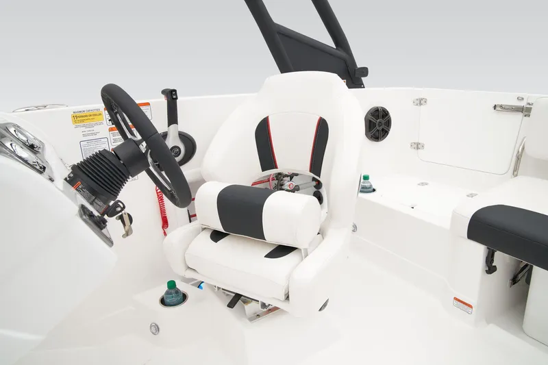 Slide: The Image of Manufacturer Provided Image: 2025 Tahoe 2150 boat interior with steering wheel and cushioned seat. - 40