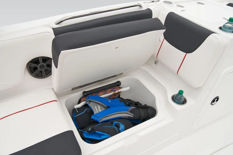 Slide: The Image of Manufacturer Provided Image: 2025 Tahoe 2150 boat storage compartment with life jackets and cup holders. - 49