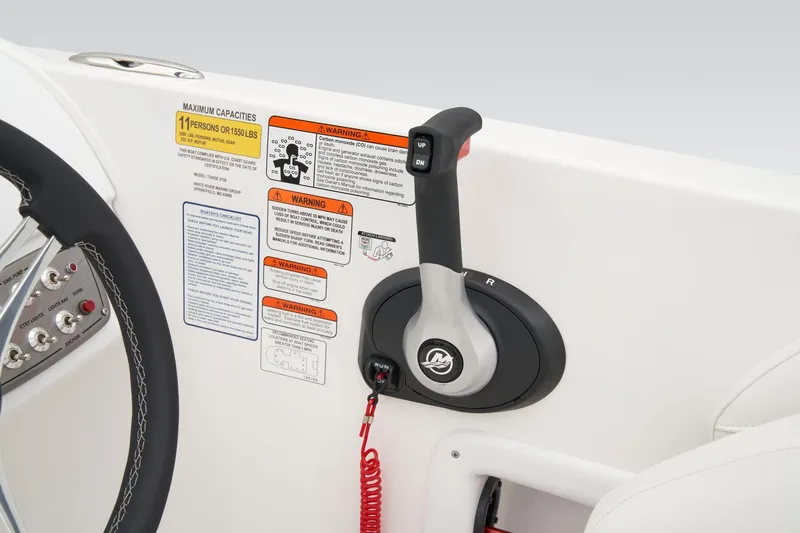 Slide: The Image of Manufacturer Provided Image: 2025 Tahoe 2150 boat throttle control with safety warnings and steering wheel. - 53