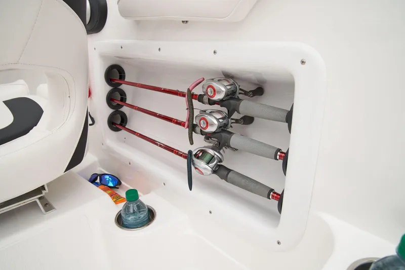 Slide: The Image of Manufacturer Provided Image: 2025 Tahoe 2150 boat interior with fishing rod holders and cup holder. - 54