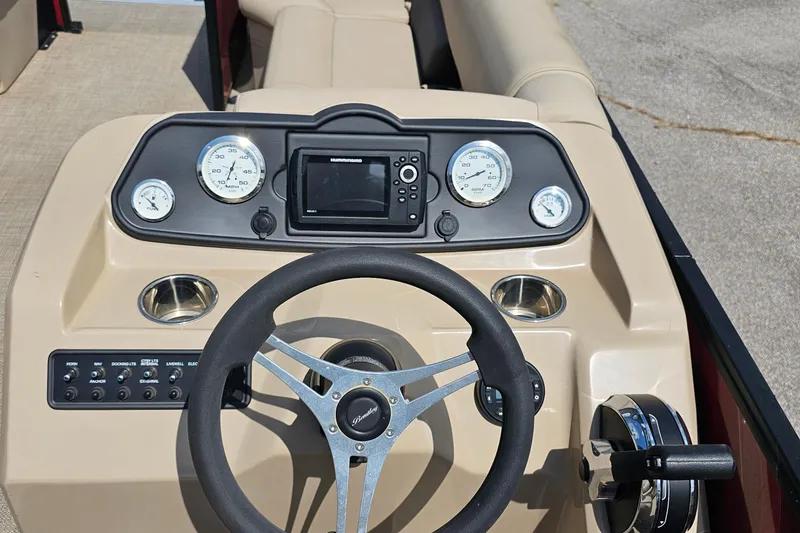 Slide: The Image of 2021 Bentley Pontoons 200 CRUISE dashboard with steering wheel and gauges. - 10
