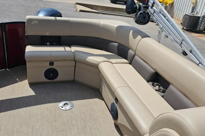 Slide: The Image of 2021 Bentley Pontoons 200 CRUISE interior with beige seating and cup holders. - 16