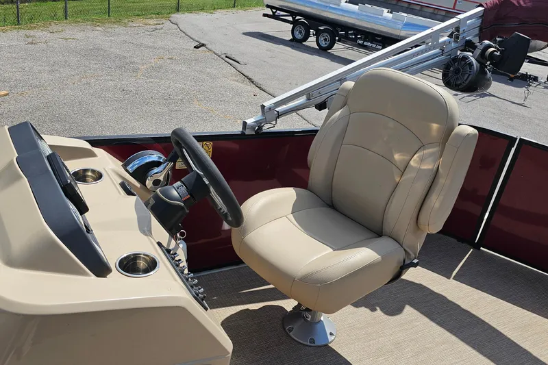 Slide: The Image of 2021 Bentley Pontoons 200 CRUISE helm with beige captain's chair and steering wheel. - 9