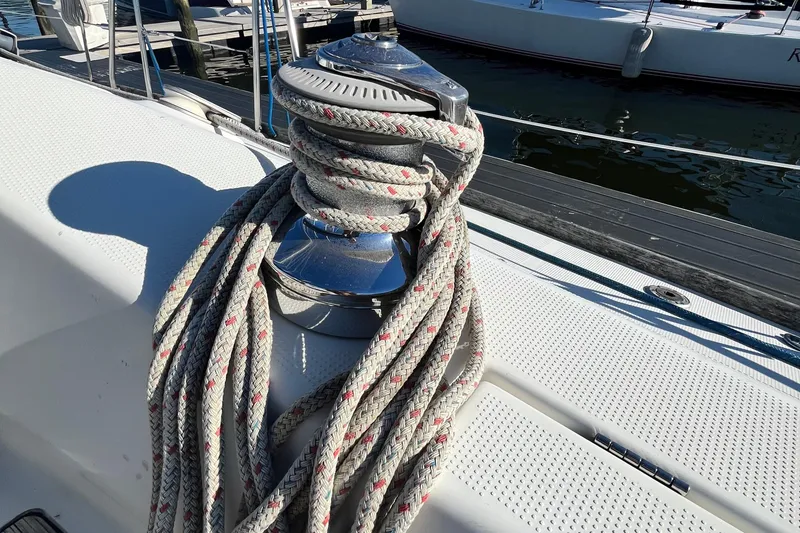 Slide: The Image of Winch with coiled rope on 1994 Beneteau First 35s7 sailboat deck. - 10
