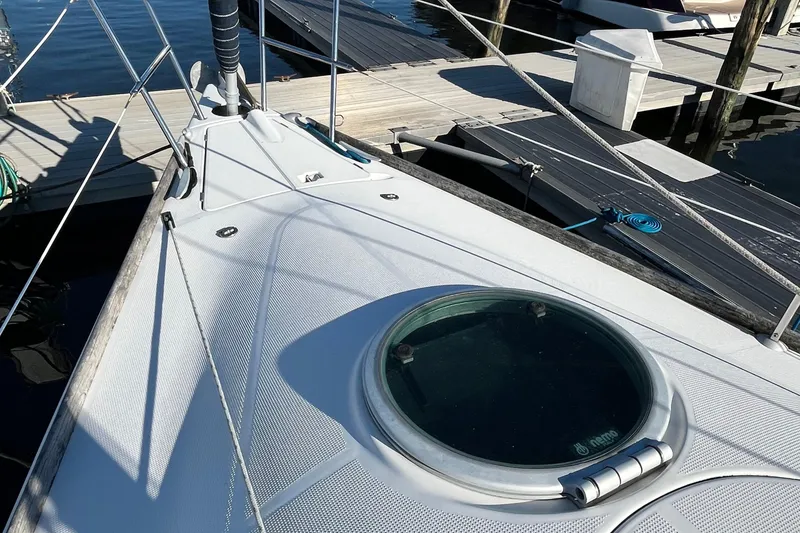 Slide: The Image of Deck of 1994 Beneteau First 35s7 sailboat docked at marina. - 15
