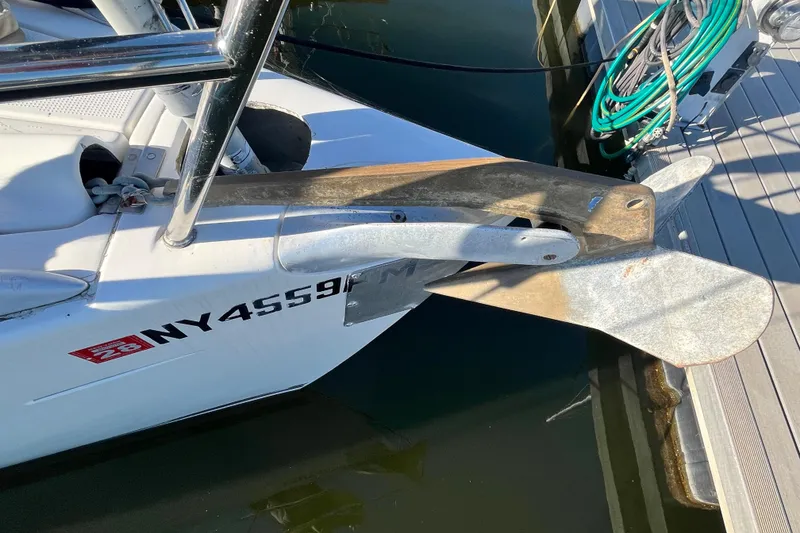 Slide: The Image of Beneteau First 35s7 sailboat anchor and bow detail, docked, 1994 model. - 20