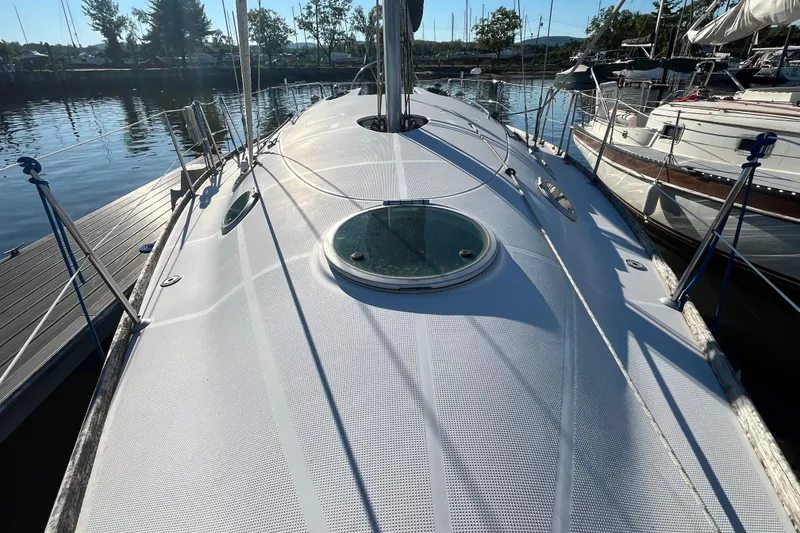 Slide: The Image of 1994 Beneteau First 35s7 sailboat deck view at marina, sunny day. - 21