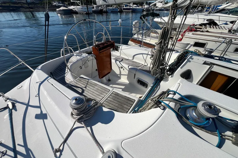 Slide: The Image of Cockpit of a 1994 Beneteau First 35s7 sailboat, featuring winches and steering wheel. - 24